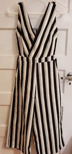 One piece romper, with open tie back. From Honey